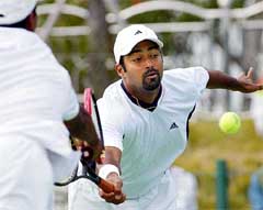 India's Leander Paes and his pair Mahesh Bhupathi dive for the ball