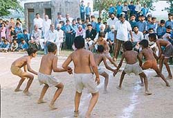 Players in action during a kabaddi final of the block-level Primary School Games: 2002 in Government Primary School, Devi Nagar, near Dera Bassi