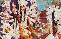 A priest worships Goddess Durga during celebrations in Banga Bhavan