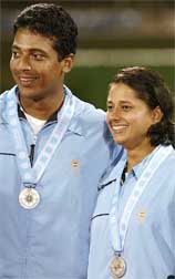 India's tennis pair Mahesh Bhupathi and Manisha Malhotra pose with their mixed doubles silver medals