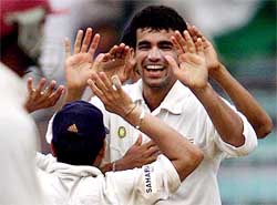 Zaheer Khan celebrates with teammate Sachin Tendulkar