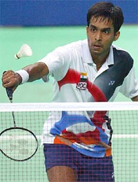 India's Pullela Gopichand returns a net play from South Korea's Shon Seung Mo during the men's singles quarterfinal