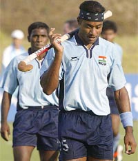 India's Daljit Singh leaves the field after South Korea defeated India in the men's hockey final match