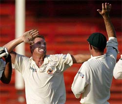 Australian bowler Shane Warne celebrates winning the second Test match