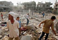 Palestinians search the ruins of their destroyed houses