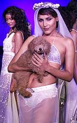 Models display creations of Indian designer