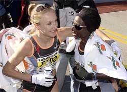 Great Britain's Paula Radcliffe and Catherine Ndereba of Kenya
