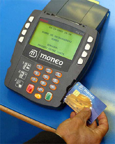 A consumer inserts his MONEO 'change purse' card into a terminal 