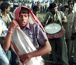 A young devotee dances during the immersion ceremony