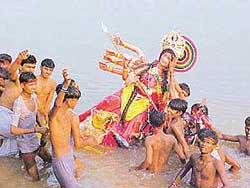 A Dura idol being immersed in the Sutlej after Durga Puja