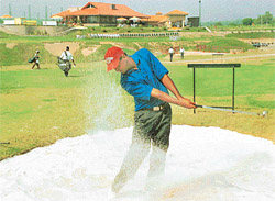 Mukesh, who returned a four-under card, is caught in a bunker in the Forest Hill Golf Open 