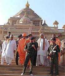Vishwa Hindu Parishad chief Ashok Singhal comes out after visiting the Akshardham temple