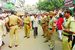 Armed cops keeping a vigil at Khari Baoli market in the Capital as the traders downed shutters following a clash with an Income-Tax team on Thursday.