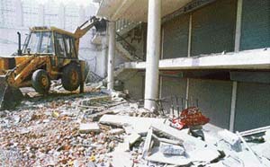 MC bulldozer at work at a commercial complex on Ferozepore Road in Ludhiana on Friday.