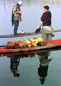 A Japanese tourist buys a bunch of flowers