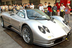 Local residents look at an Italian-made "Pagani Zonda C12S"