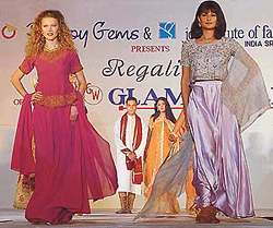 Models sashay down the ramp, portraying the latest in designs of garments 