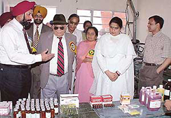 Dr G.S. Kochhar, president, Rotary Shivalik, Chandigarh, shows the medicines on display to the Governor