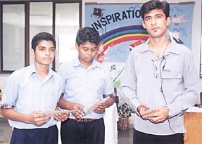 Anurag and Abhishek, winners of the quiz competition held at Eicher School, Faridabad, with quiz master Nitin Arora