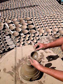 Earthen lamps being prepared for the forthcoming Diwali festival