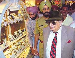 The UT Administrator, Lieut-Gen J.F.R. Jacob, visits a shop in the Sector 22-D market after inaugurating the second phase of the golden-jubilee shopping festival