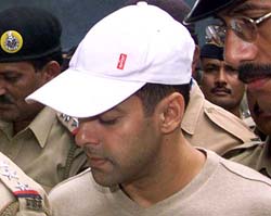 Police officials escort filmstar Salman Khan