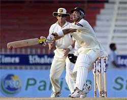 Pakistan's batsman Hasan Raza hits the ball