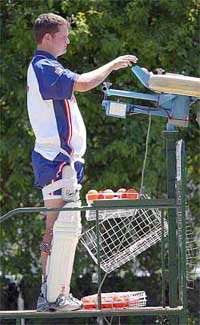 England cricketer Robert Key adjusts a bowling machine