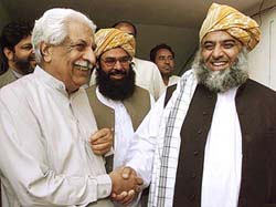 Mr Fazal-ur-Rehman, Secretary-General of the Muttahida Majlis-e-Amal, greets National Alliance chief