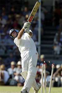 England captain Nasser Hussain is bowled by Australia's Peter Wilson during England's tour match against the ACB Chairman's XI at Lilac Hill