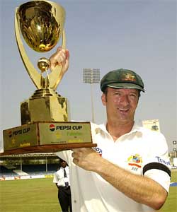 Australian captain Steve Waugh holds the trophy at Sharjah Cricket Stadium on Tuesday