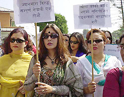 Nepalese film actresses and women activist hold placards