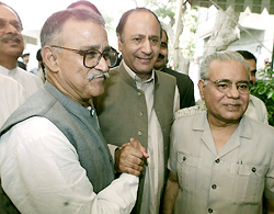 Pakistan Muslim League (Quaid-e-Azam) parliamentary party leader Choudhary Shujahat Hussain greets Mutahida Quami Movement leader