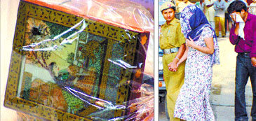 The box with a hole bored for the video camera, which on the sly taped the lewd acts. (Right) The accomplices in the sex racket being led at Rajouri Garden police station in the Capital 