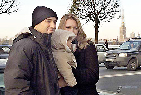 US tennis star Andre Agassi and his wife Steffi Graf hold their 11-month-old son Jaden