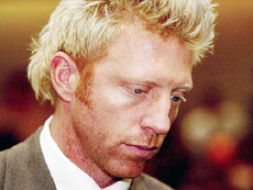 Former German tennis star Boris Becker waits in a Munich courtroom on Thursday. 
