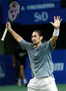 Marcelo Rios of Chile jubilates after defeating Andreas Vinciguerra