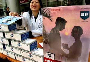A Chinese saleswoman promotes a Chinese-made medicine