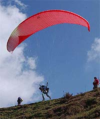 A pilot takes off on the 2nd day of the Pre-world Paragliding Competition