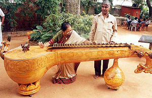 A 10-feet-long and 70-kg veena, with rare and unique features, manufactured by C. Natarajan being displayed by music exponent Shamala G. Bhave