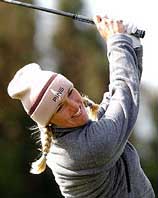 Carin Koch of Sweden watches the flight of her iron shot