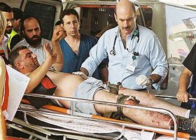 An Israeli man is taken into hospital after he was wounded by a Palestinian suicide bomber