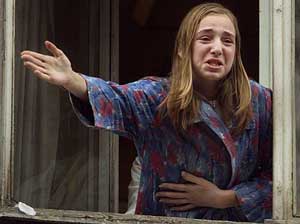 A young former hostage cries as she tries to call her mother