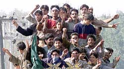 Supporters of the PDP sit on a bus