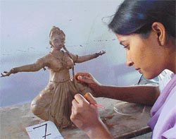 A contestant gives final touches to a model during the clay-modelling contest at the Panjab University Zonal Youth Festival