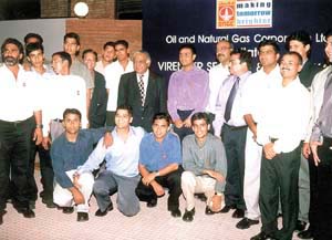 India cricketers Virender Sehwag and Mohd. Kaif at a felicitation function with ONGC CMD Subir Raha 