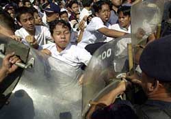 Supporters of Indonesian Muslim cleric Abu Bakar Bashir clash with the police