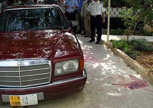 Blood stains are seen next to the Mercedes car of slain US diplomat Lawrence Foley who was shot dead by an unknown assailant 