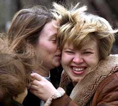 A former theatre hostage embraces a relative outside a hospital in Moscow on Friday.