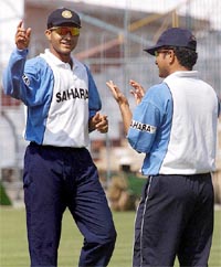 Indian cricket captain Saurav Ganguly chats with star batsman Sachin Tendulkar during a practice session on the eve of third Test match against West Indies